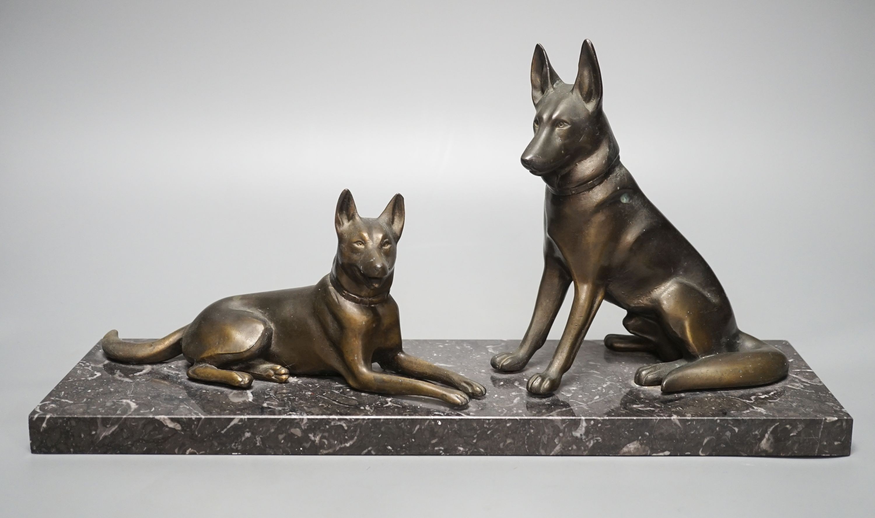 An Art Deco patinated spelter German Shepherd group, 40cm